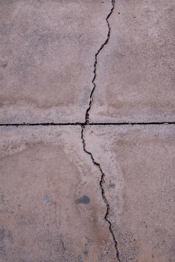 Cracked concrete surface close up