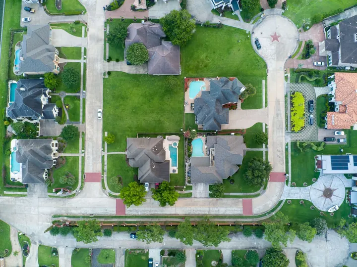Aerial view of suburban homes with pools in Houston, Texas